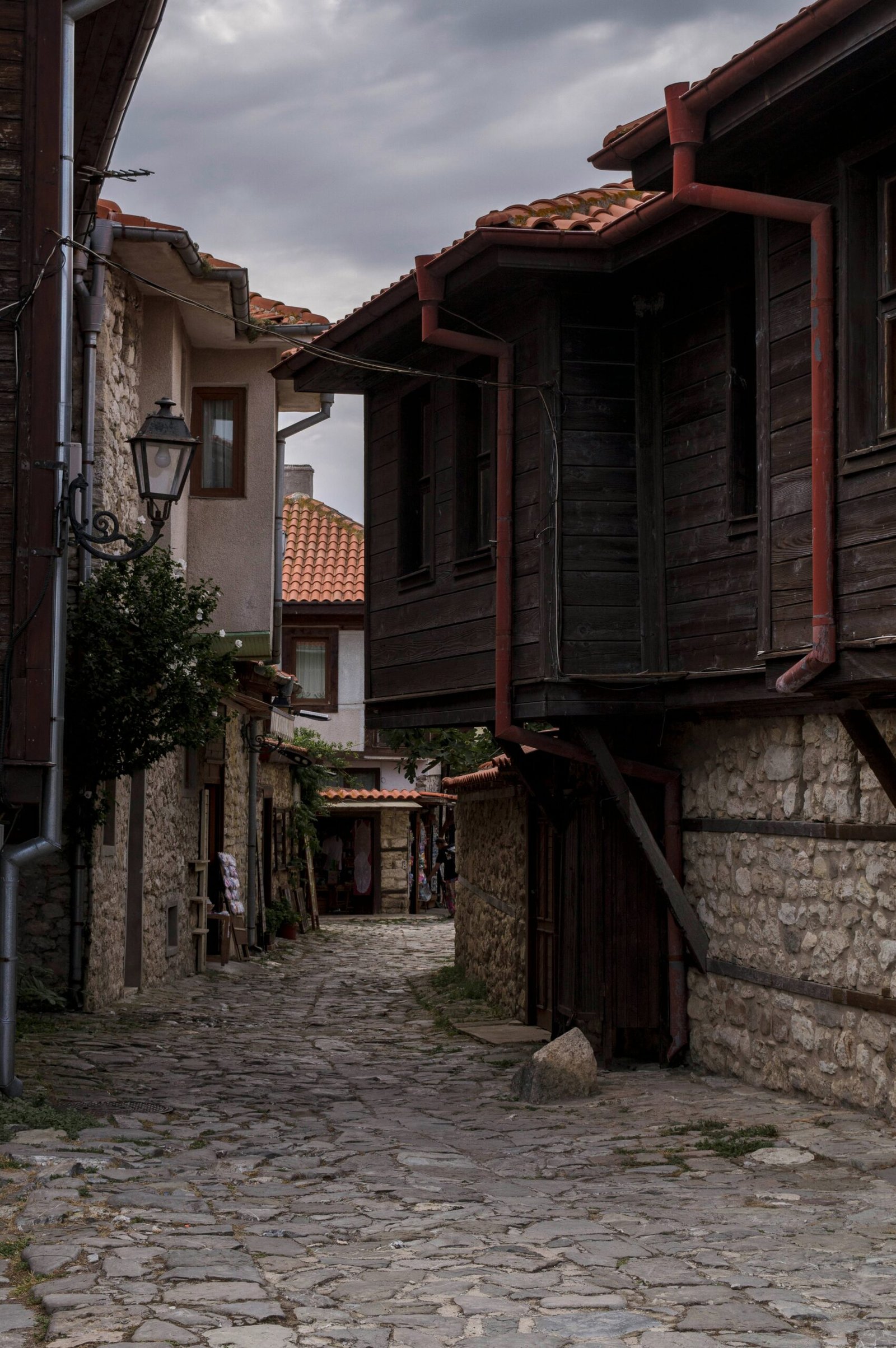 a cobblestone street with buildings on either side of it